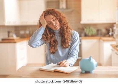 Woman Feeling Stressed While Budgeting in Kitchen - Powered by Shutterstock