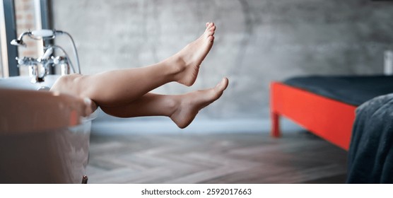 Woman feet in bathrobe at hotel room, closeup