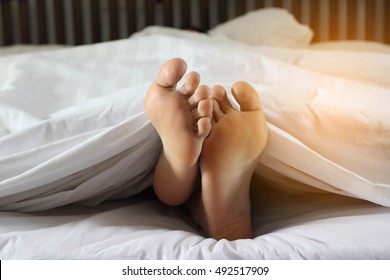 Woman Feet In Bed