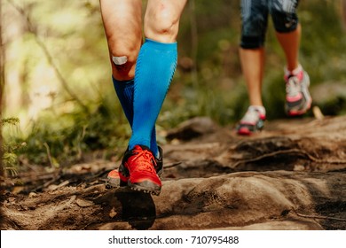 Woman Feet Runner Running Rocks In Blue Compression Socks