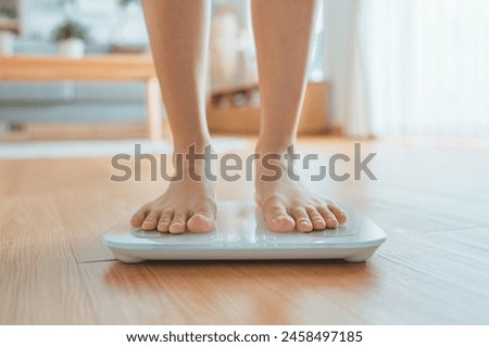 Woman Feet Standing Weighing Scales, Female Checking BMI Weight Loss. Barefoot Measuring Body Fat Overweight