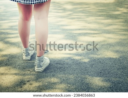 Woman feets walking in the park