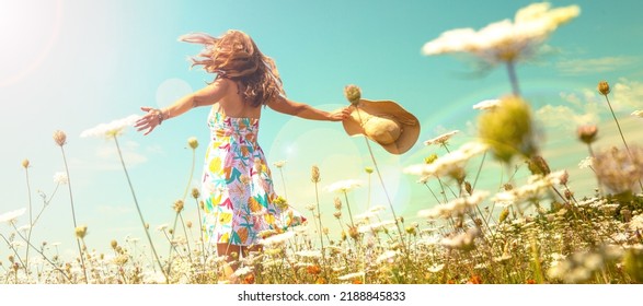 woman in a field with flowers- freedom,  active,  happiness concept - Powered by Shutterstock