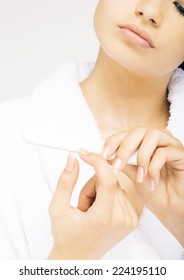 Woman Filing Nails