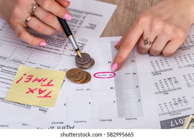 Woman filing US tax form. annual budget.