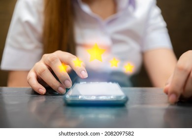 Woman Filling Out 5 Star Silver Customer Service Feedback Survey By Email On Smartphone Device After Hotel Guest Experience - Company Satisfaction Rating, Retention And Quality Of Service Concepts