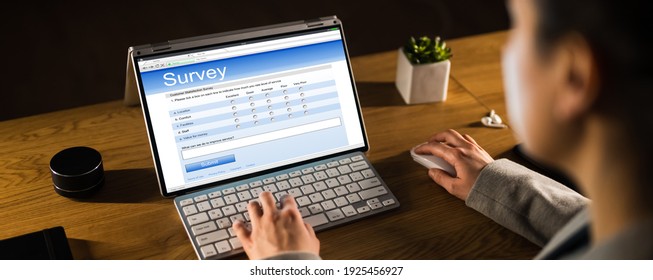 Woman Filling Survey Form On Tablet Screen