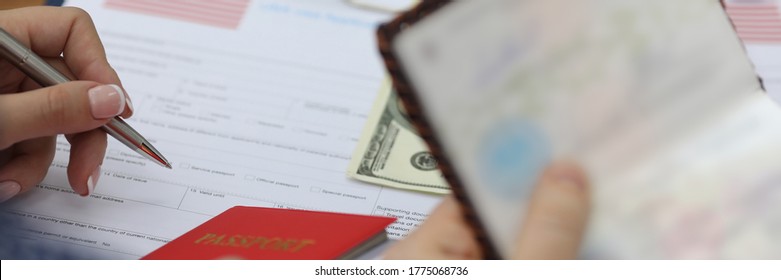 Woman fills out visa application form in usa. Obtaining passport at embassy. Payment consular fee in cash. Analysis old questionnaire and correction errors. - Shutterstock ID 1775068736