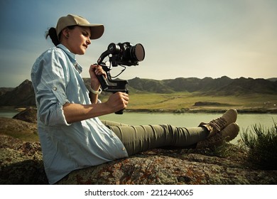 Woman Filmmaker Operator With Compact Three-axis Stabilizer Zhiyun Weebill S In Hand Outdoor. Almaty, Kazakhstan, 02 May, 2022