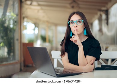 Woman With Finger On The Lips Looking At Laptop. Female Cyber Criminal Catfishing And Scamming Online
