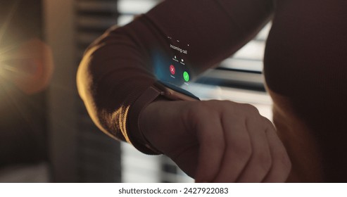 Woman fingers does double tap on smart watch for hands-free interaction. 3d rendering incoming call on smart watch. Young woman is typing on laptop at the work table at the office. - Powered by Shutterstock