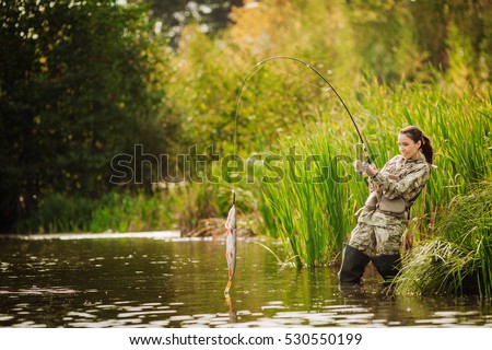 woman fishes on the river