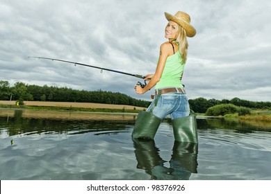 Woman Fishing In Pond