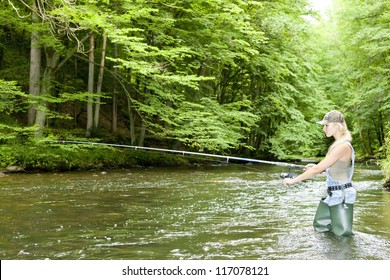 Woman Fishing In River