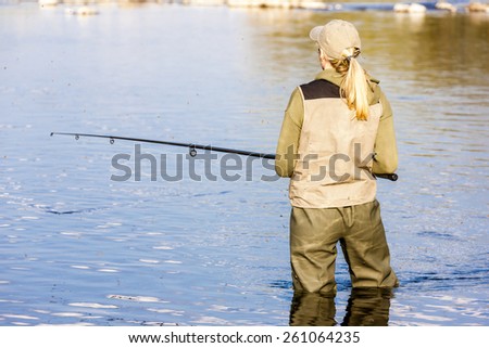 woman fishing in the river