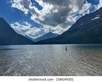 Woman Fishing In Two Medicine Lake Glacier National Park