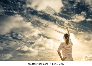 Woman with fist up to the sky. 