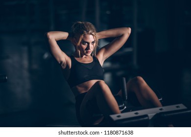 Woman Fit Build Muscle Exercise Gym
,Woman Exercising Abdominal Surface On GYM.Attractive Builder Muscles Women In Fitness Gym
