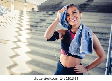 Woman, fitness and portrait smile with towel to dry sweat from intense workout, exercise or training. Happy sporty female smiling ready for exercising or healthy wellness outdoors. - Powered by Shutterstock