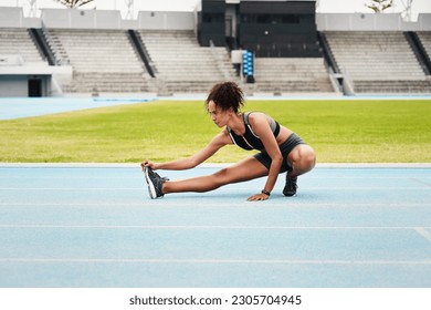 Woman, fitness and stretching body on stadium track for running, exercise or workout. Active female person or athlete in warm up leg stretch for sports training, athletics or cardio run outdoors