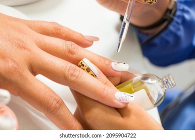 fixing her nail polish