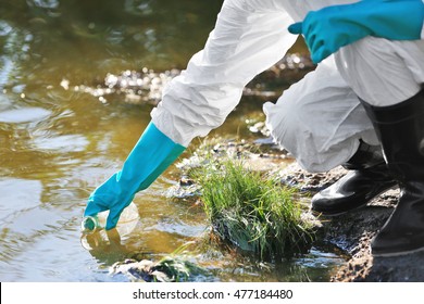 Woman with flask for expertise. Environmental pollution concept - Shutterstock ID 477184480