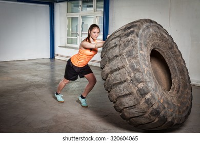 Woman Flipping Tire