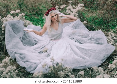 A woman with a floral crown sits gracefully in a meadow, surrounded by wildflowers and lush greenery, exuding serenity and elegance in a flowing white dress that adds to the dreamy ambiance - Powered by Shutterstock