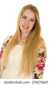 A Woman In Flower Top With Sheer Shirt With A Smile On Her Face.