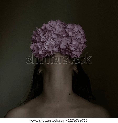 Similar – a girl with blue eyes and long hair covering herself with a gerbera flower