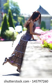 woman in flowers outdoor - Shutterstock ID 145797260