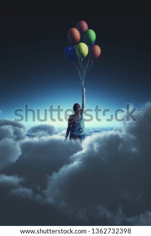 Woman flying with balloons to the sky during night, above clouds
