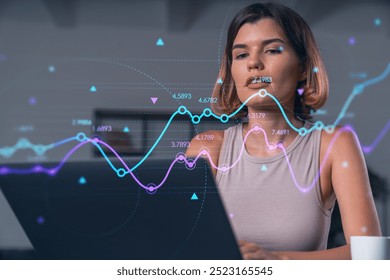 Woman focused on analyzing dynamic data visualizations on a transparent screen, modern office background, concept of data analysis and technology - Powered by Shutterstock