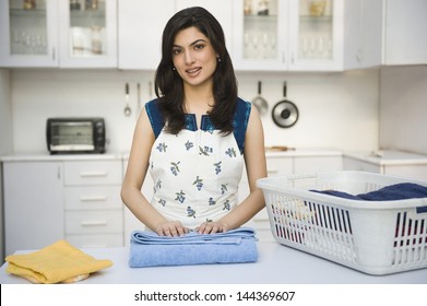 Woman Folding Laundry