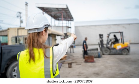 Woman Foreman Control Forklift Carry Big Wheel Of Containers Cargo Forklift At Maintenance Shop In Warehouse , Manager Woman In White Helmet Safety Supervisor In Container Custom Terminal Port