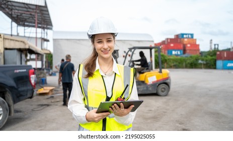 Woman Foreman Control Forklift Carry Big Wheel Of Containers Cargo Forklift At Maintenance Shop In Warehouse , Manager Woman In White Helmet Safety Supervisor In Container Custom Terminal Port