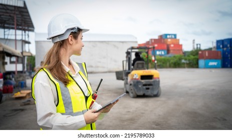 Woman Foreman Control Forklift Carry Big Wheel Of Containers Cargo Forklift At Maintenance Shop In Warehouse , Manager Woman In White Helmet Safety Supervisor In Container Custom Terminal Port