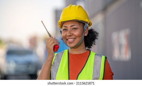 Woman Foreman Control Loading Containers Box In Warehouse , Worker Inspector Or Safety Supervisor In Container CustomTerminal Port Concept Import Export Transportation And Logistic Service