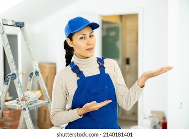 Woman Foreman Shows With Her Hand At A Job Well Done On The Repair Of The Premises