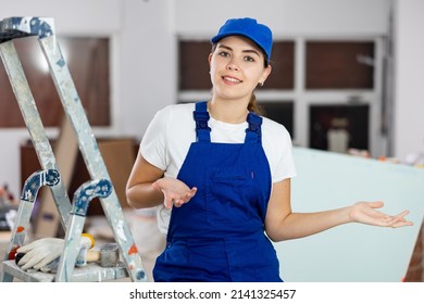 Woman Foreman Shows With Her Hand At A Job Well Done On The Repair Of The Premises