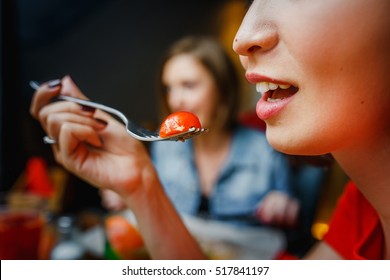 Woman With A Fork At The Mouth With Cherry Tomatoes