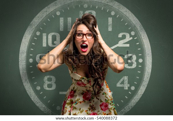 Woman freaking out in extreme anxiety panic attack,
late, out of time, clock