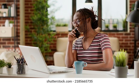 Woman Freelancer Answering Phone Call At Remote Job, Working From Home And Talking To Manager On Smartphone. Using Telephone Line To Chat Remotely, Telecommunications Network At Desk.