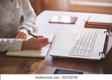 Woman Freelancer Female Hands With Pen Writing On Notebook At Home Or Office