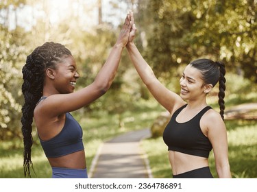 Woman, friends and high five in nature for fitness, teamwork or outdoor training goals together. Female person touching hands in celebration for team exercise, running or sports practice at the park - Shutterstock ID 2364786891