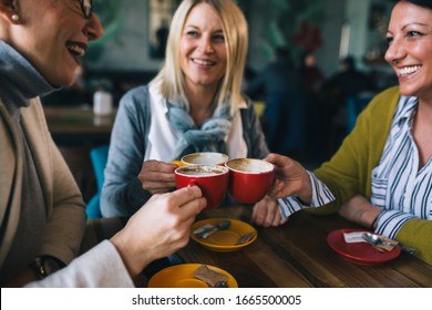 Woman Friends On Coffee Break At Cafe, Cheers With Coffee