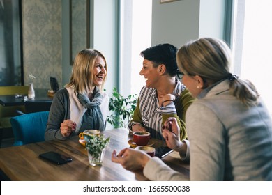 Woman Friends On Coffee Break At Cafe