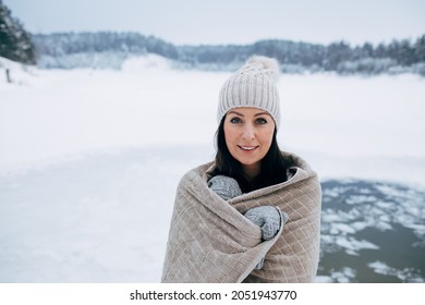 Woman In Frozen Lake Ice Hole. Winter Cold Swimming. Swimmers Wellness In Icy Water. How To Swim In Cold Water. Beautiful Young Female In Zen Meditation. Hat And Gloves Swimming Clothes. Nature Lake