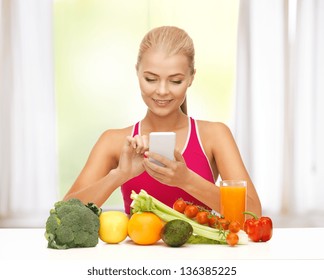 Woman With Fruits And Vegetables Counting Calories On Smartphone