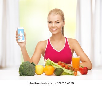 Woman With Fruits And Vegetables Counting Calories In Smartphone